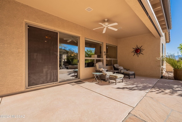 view of patio featuring ceiling fan