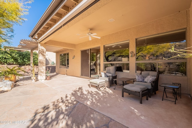 view of patio with an outdoor living space, ceiling fan, and a pergola