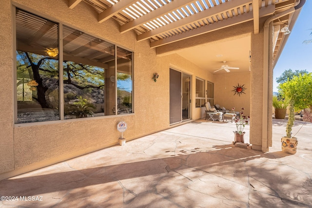 view of patio / terrace featuring a pergola and a ceiling fan