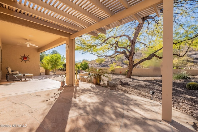view of patio with a pergola, a fenced backyard, and a ceiling fan