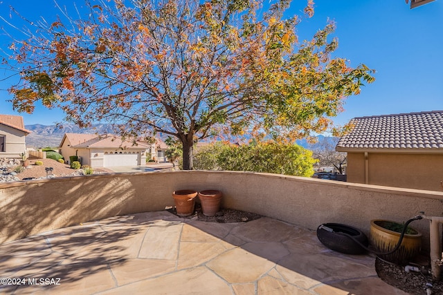 view of patio / terrace featuring a balcony and a mountain view