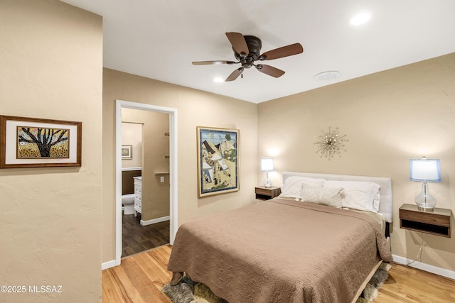 bedroom with wood-type flooring and ceiling fan