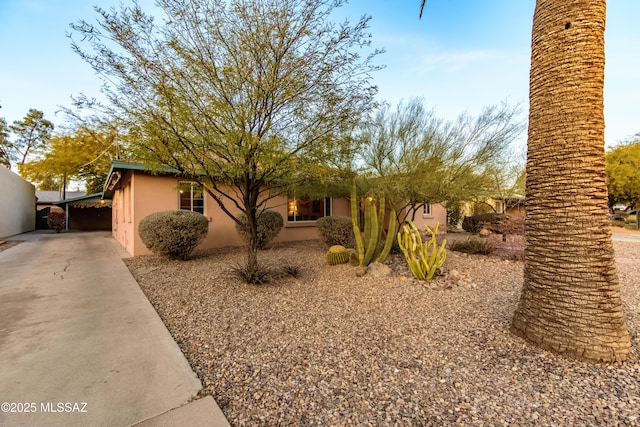 view of front of property featuring a carport