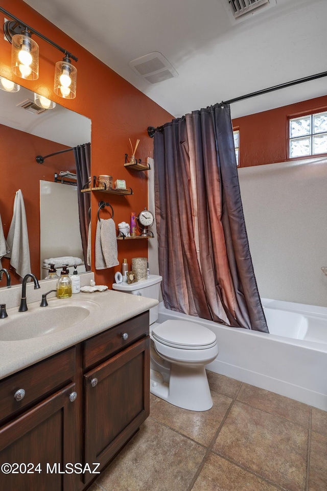 full bathroom featuring tile patterned floors, vanity, toilet, and shower / bathtub combination with curtain