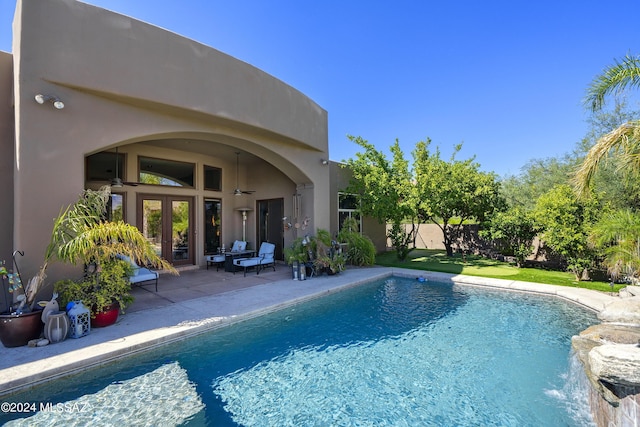 view of pool with a patio area and french doors