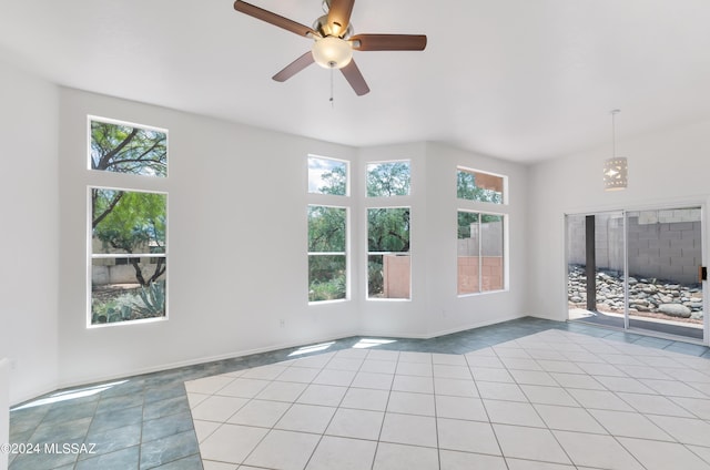 unfurnished living room with ceiling fan and light tile patterned floors