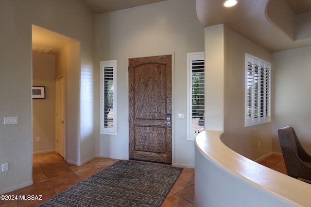 entrance foyer featuring tile patterned floors and baseboards