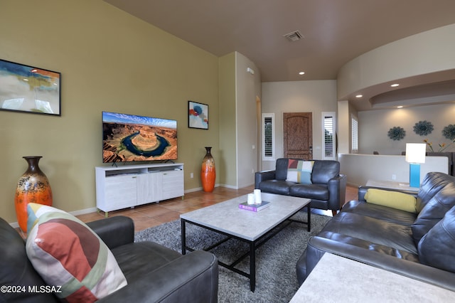 living room featuring recessed lighting, baseboards, visible vents, and tile patterned floors