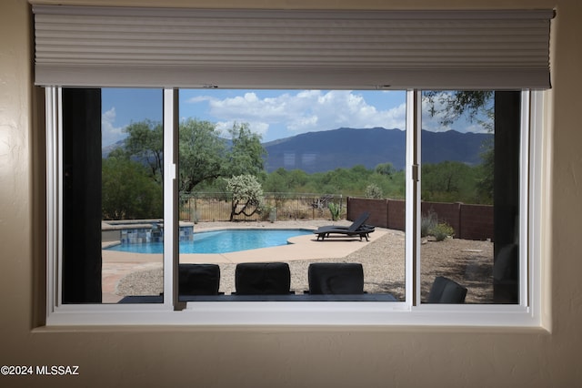 view of swimming pool featuring a mountain view