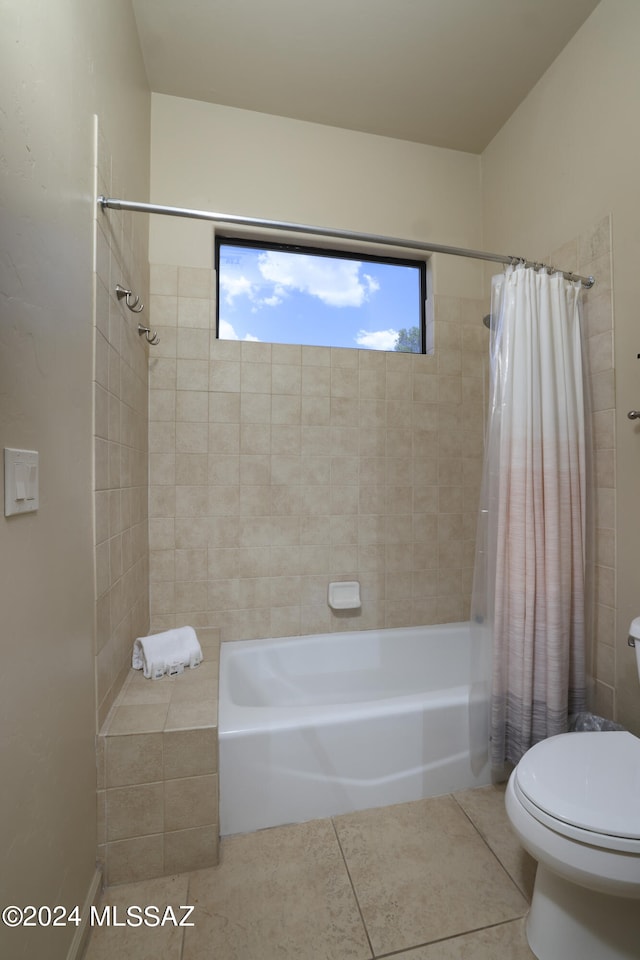 bathroom with toilet, tile patterned floors, and shower / bath combination with curtain