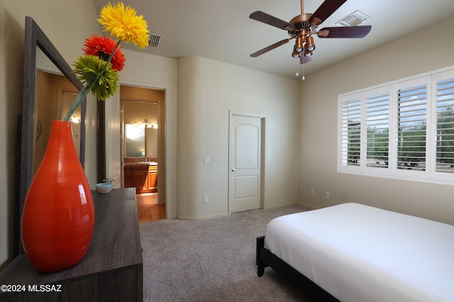 bedroom featuring visible vents, carpet flooring, and baseboards