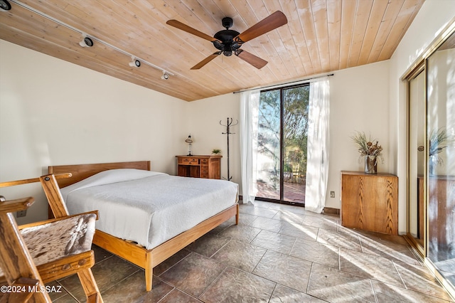 bedroom featuring track lighting, expansive windows, access to outside, ceiling fan, and wooden ceiling