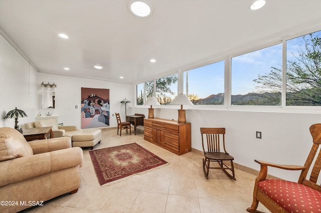 interior space featuring a mountain view, crown molding, and light tile patterned flooring