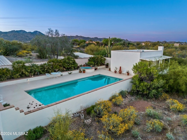 view of swimming pool featuring a mountain view