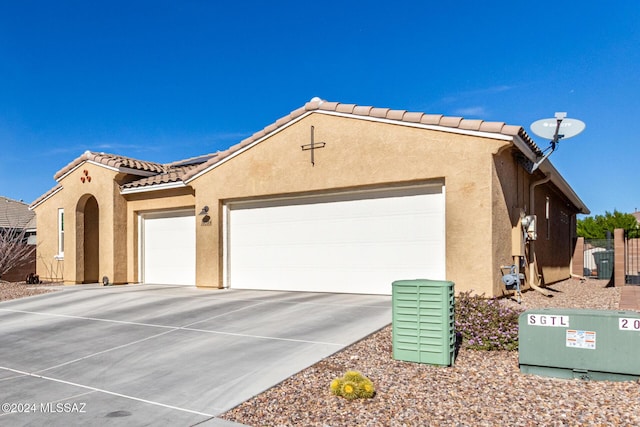 view of side of home with a garage