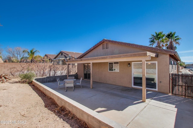 back of property with a patio area