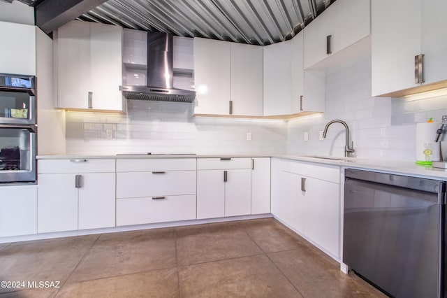 kitchen with white cabinetry, stovetop, wall chimney range hood, and dishwashing machine