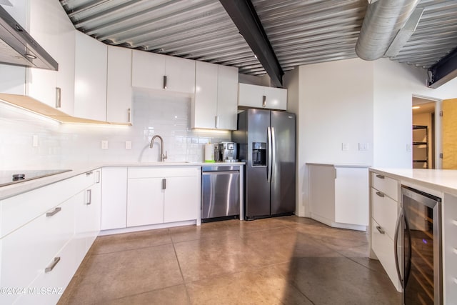 kitchen featuring range hood, stainless steel appliances, wine cooler, white cabinets, and sink