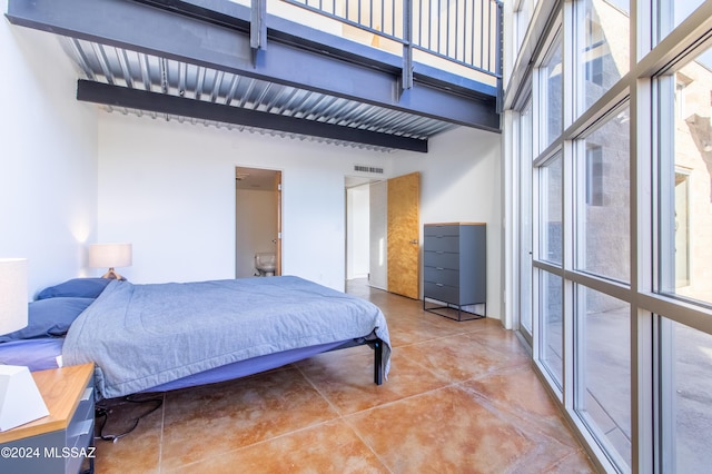 bedroom with a towering ceiling