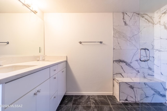 bathroom featuring walk in shower and vanity