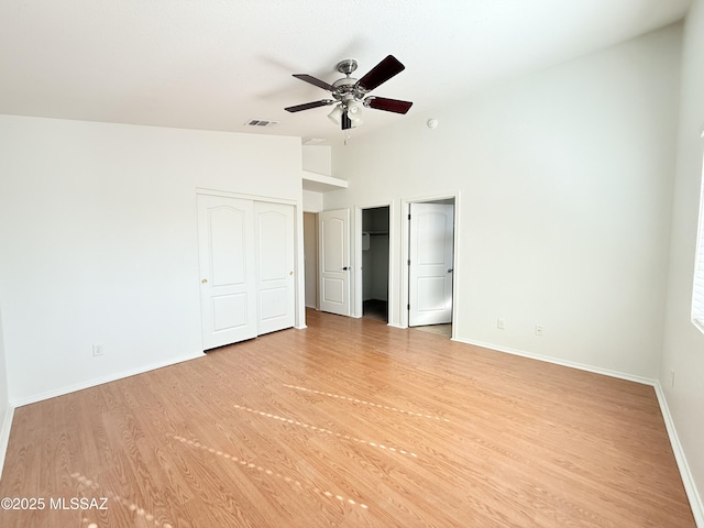 unfurnished bedroom with light wood-type flooring and ceiling fan