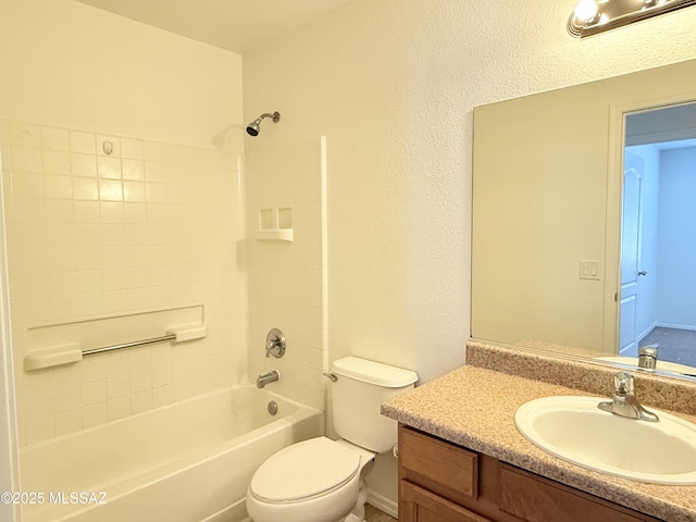 full bathroom featuring vanity, washtub / shower combination, and toilet