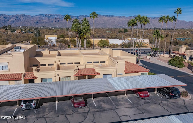 birds eye view of property featuring a mountain view