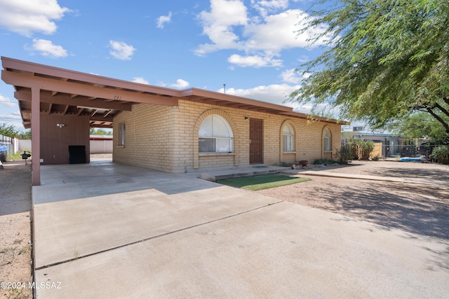 view of front facade with a carport