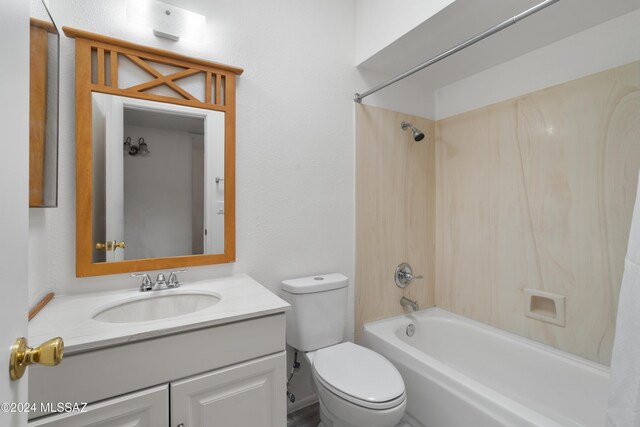 full bathroom with shower / washtub combination, vanity, and toilet