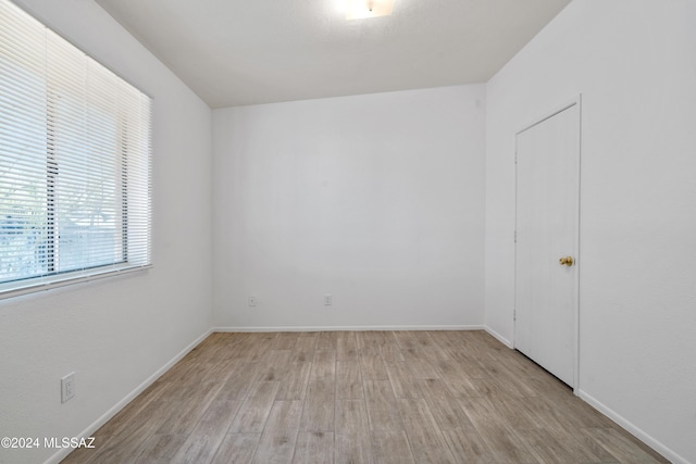 unfurnished room featuring light hardwood / wood-style flooring