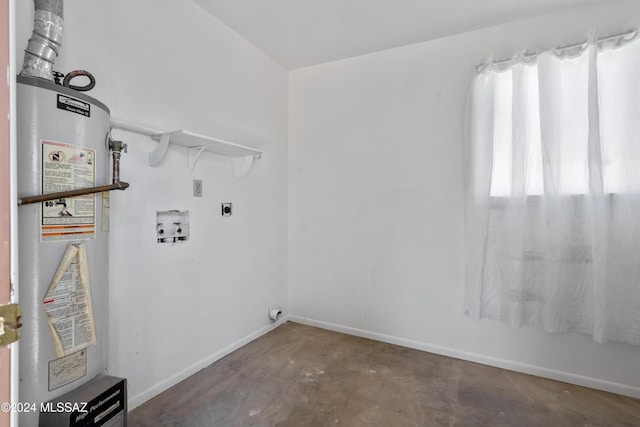 laundry area with hookup for an electric dryer, hookup for a washing machine, and water heater