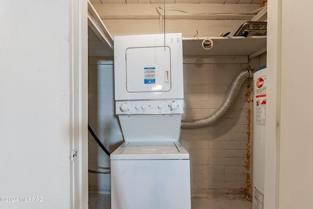 71 N Las Yucas, Green Valley, AZ 85614 - laundry area with estacked washer and dryer and concrete block wall