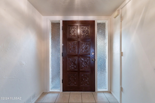 interior space featuring light tile patterned floors