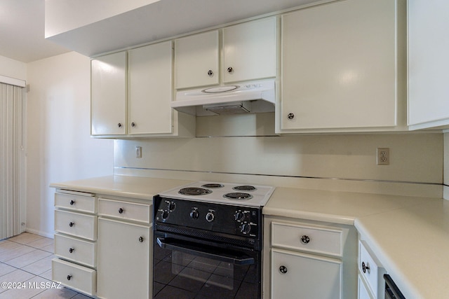 kitchen with white cabinets, black range with electric cooktop, and light tile patterned flooring