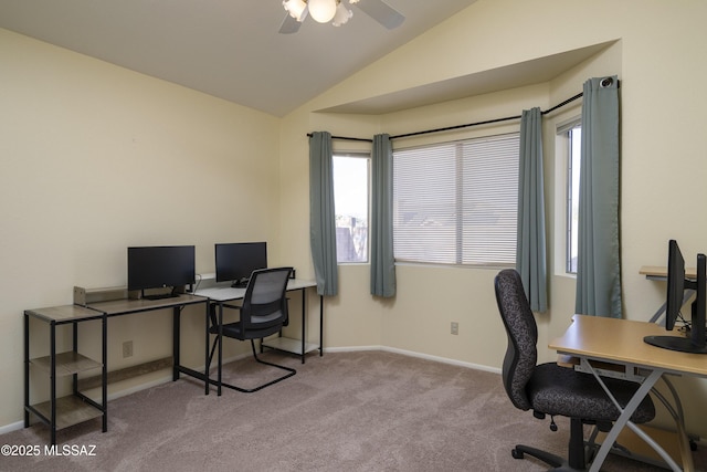 carpeted office space with ceiling fan and lofted ceiling