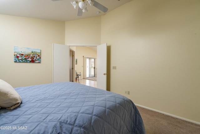 bedroom with ceiling fan and carpet floors