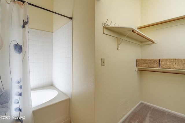 bathroom with shower / bath combination with curtain