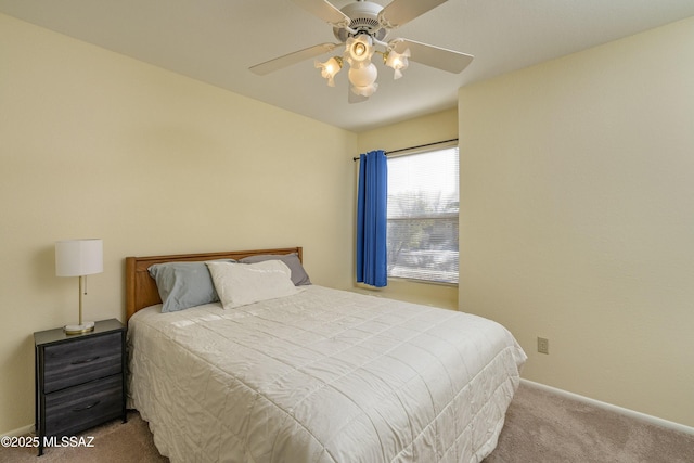 bedroom with ceiling fan and light carpet