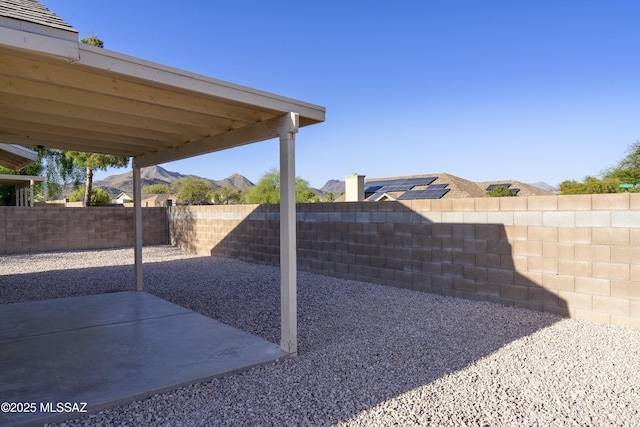 view of yard with a mountain view and a patio