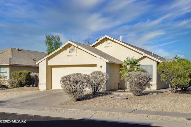 ranch-style house featuring a garage