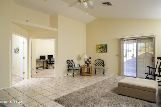 sitting room with lofted ceiling, ceiling fan, and light tile patterned floors