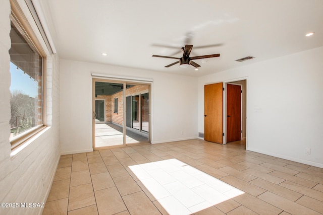 spare room with ceiling fan