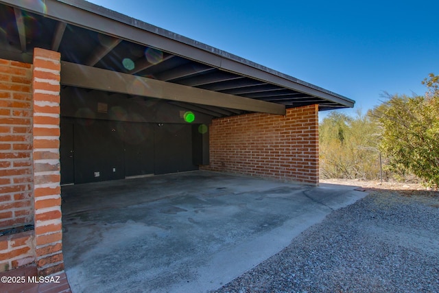 view of parking / parking lot featuring a carport