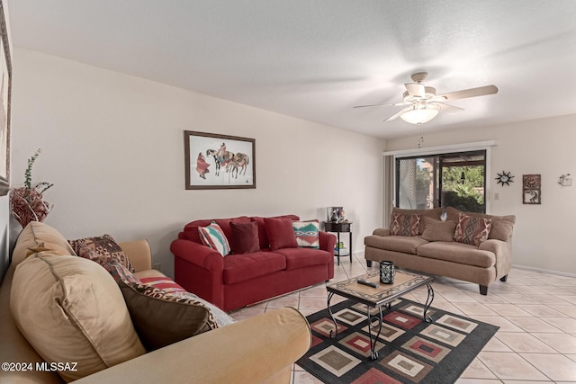 living room with ceiling fan and light tile patterned floors