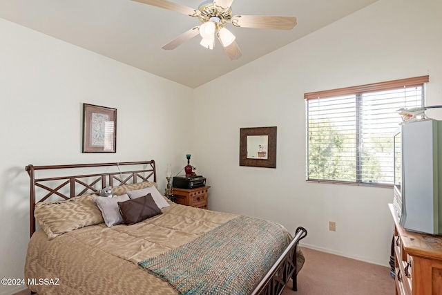 carpeted bedroom with multiple windows, ceiling fan, and lofted ceiling