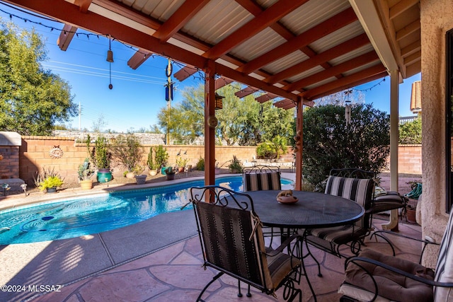 view of swimming pool with a patio