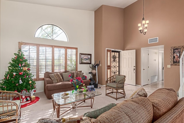 living room featuring light carpet, a chandelier, and a high ceiling