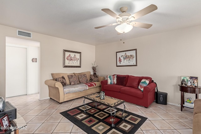 tiled living room featuring ceiling fan