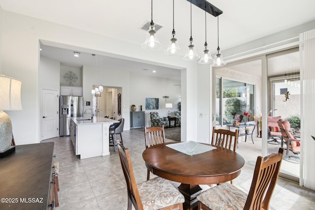 tiled dining area featuring sink