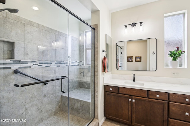 bathroom with vanity and an enclosed shower